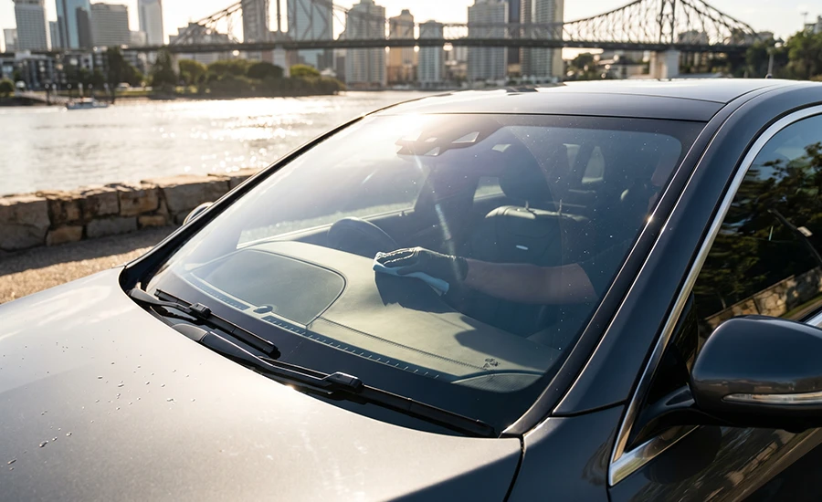 Clear window film protecting a vehicle interior from UV damage in Queensland